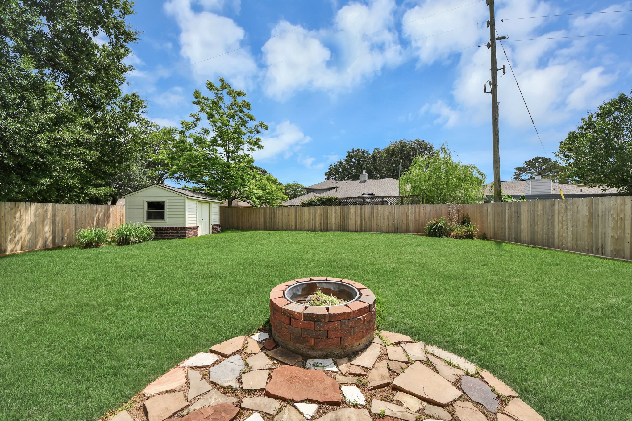 7622 McCormick Mill Court Houston, TX 77095 - Photo 32 of 37 a view of a backyard with a garden