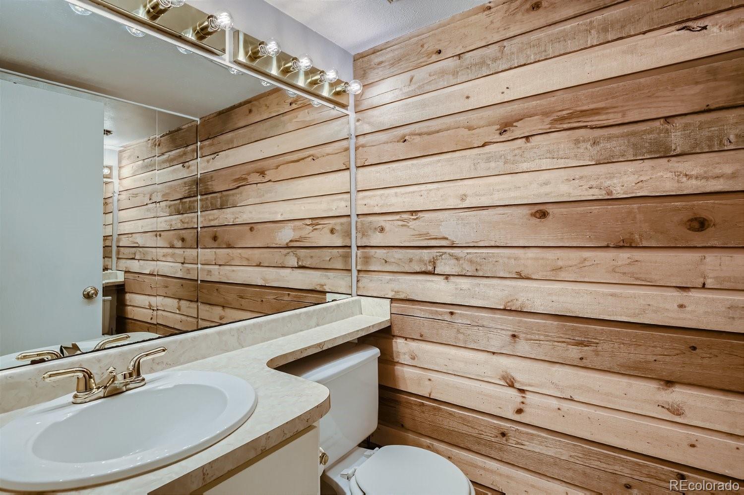 11099 Fairfax Circle Thornton, CO 80233 - Photo 17 of 33 a bathroom with a sink and a mirror