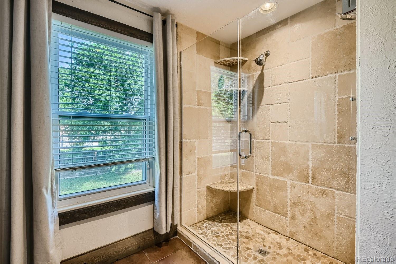 11099 Fairfax Circle Thornton, CO 80233 - Photo 23 of 33 a bathroom with a shower