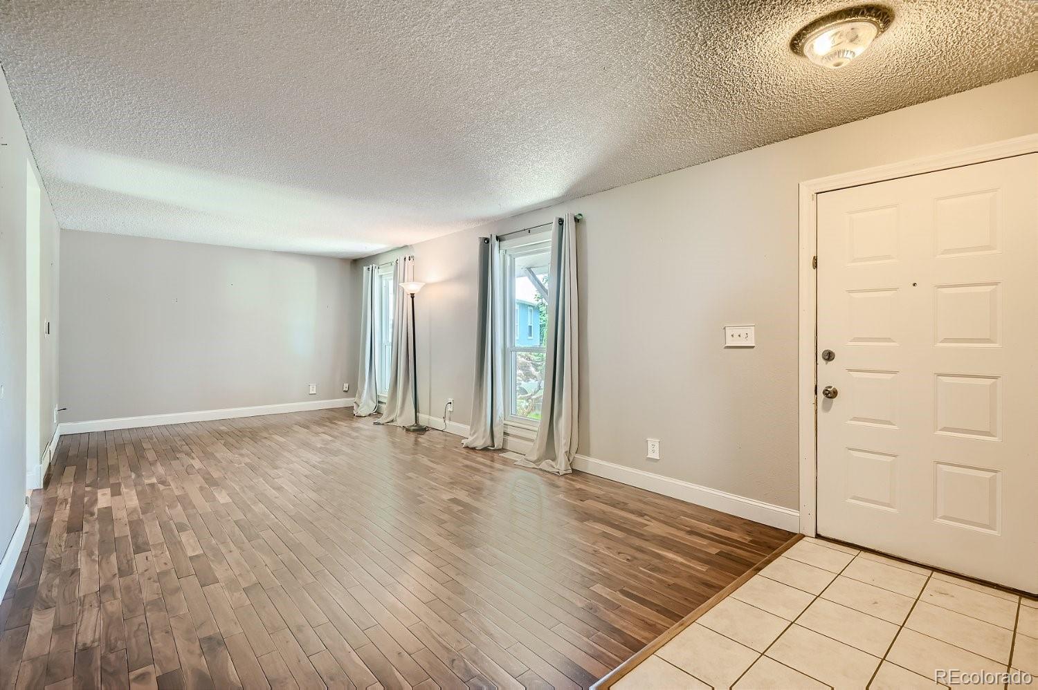 11099 Fairfax Circle Thornton, CO 80233 - Photo 6 of 33 a view of an empty room and window