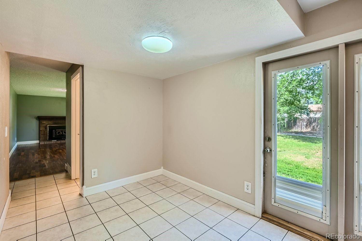 11099 Fairfax Circle Thornton, CO 80233 - Photo 9 of 33 a view of an empty room and window