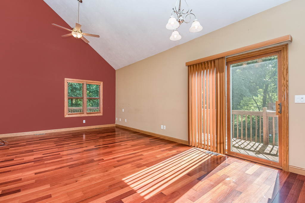 331 Rickert Street Hinckley, IL 60520 - Photo 3 of 19 a view of an empty room with wooden floor and a window