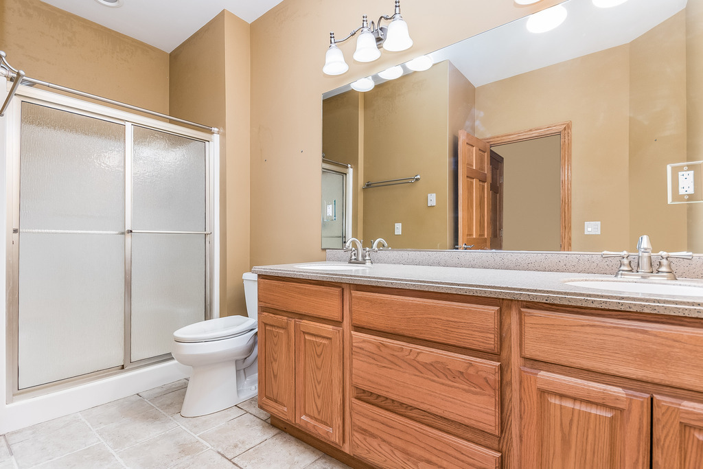 331 Rickert Street Hinckley, IL 60520 - Photo 9 of 19 a bathroom with a sink a toilet and a mirror