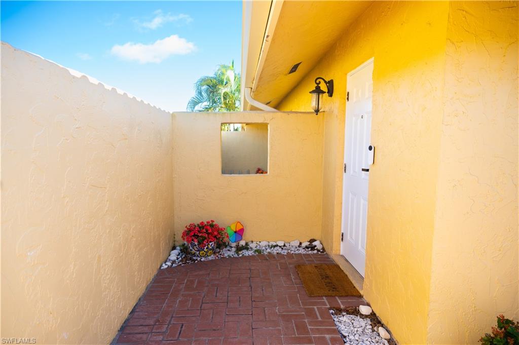 136 Harrison Road, Unit L3 Naples, FL 34112 - Photo 4 of 50 a view of a door and an outdoor space