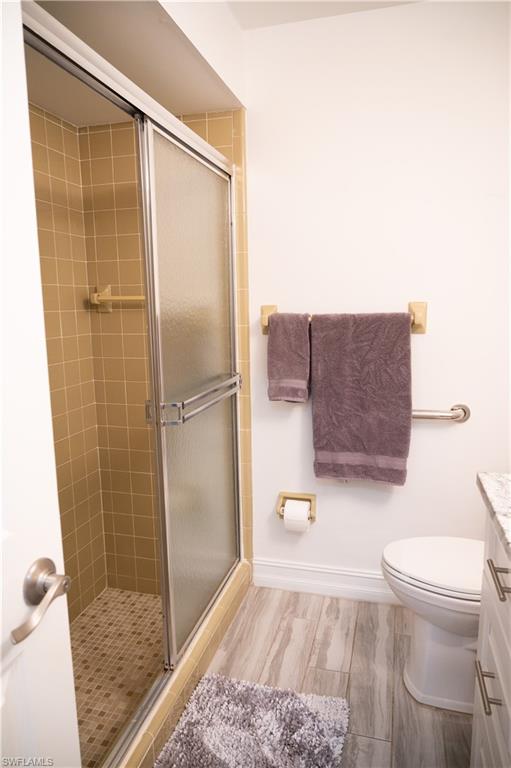 136 Harrison Road, Unit L3 Naples, FL 34112 - Photo 45 of 50 a bathroom with a toilet and a shower