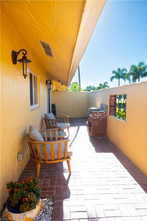 136 Harrison Road, Unit L3 Naples, FL 34112 - Photo 6 of 50 a building outdoor space with patio furniture