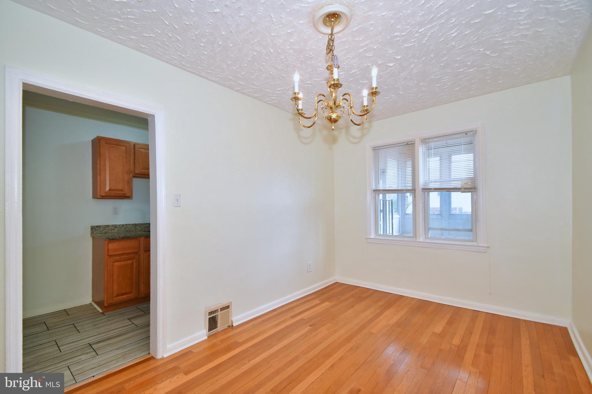 731 Roundview Road Baltimore, MD 21225 - Photo 8 of 40 a view of an empty room with a window