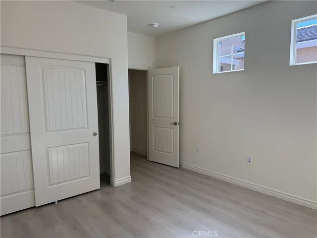 an empty room with wooden floor