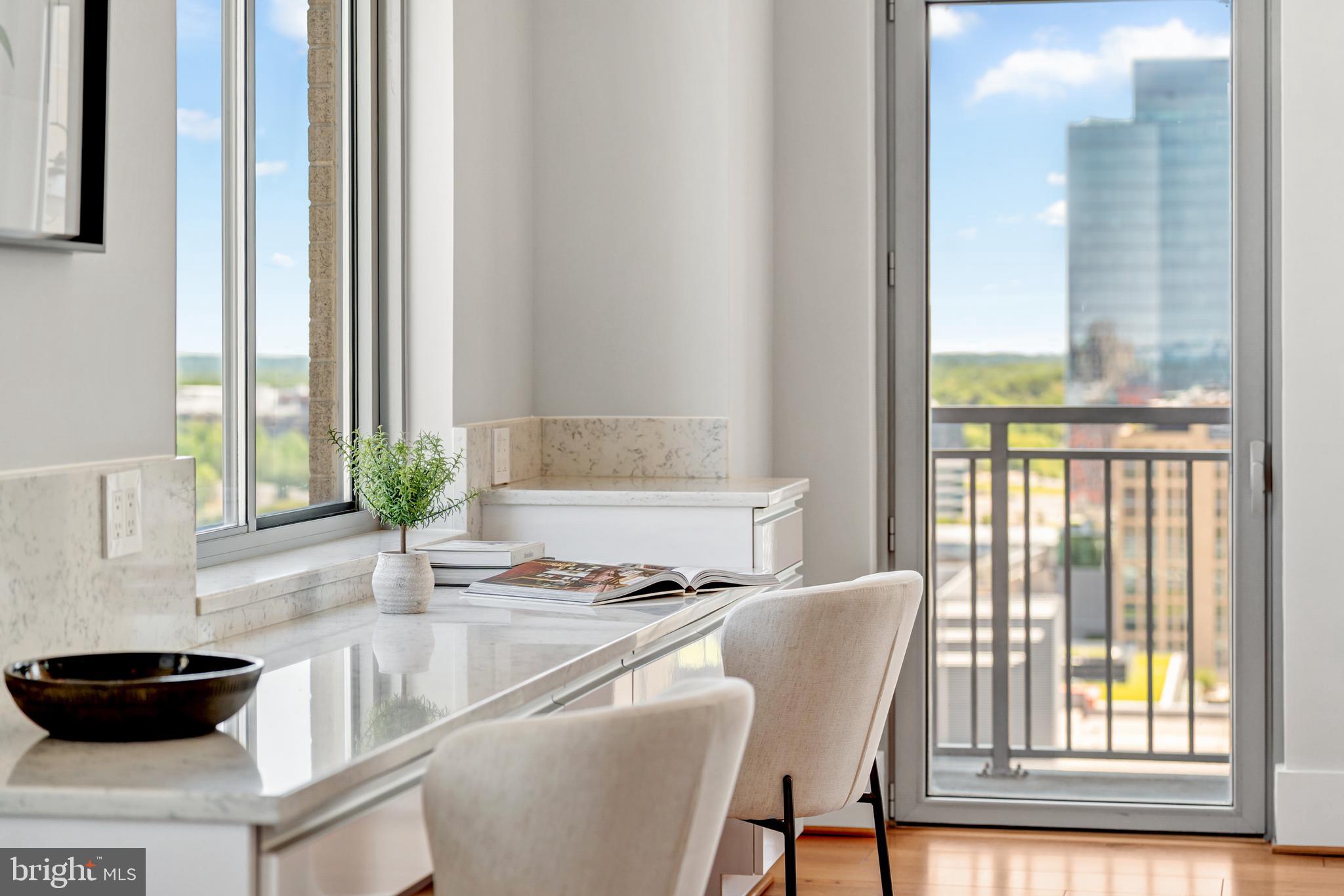 11990 Market Street, Unit 2112 Reston, VA 20190 - Photo 16 of 92 a kitchen with a table chairs and a window
