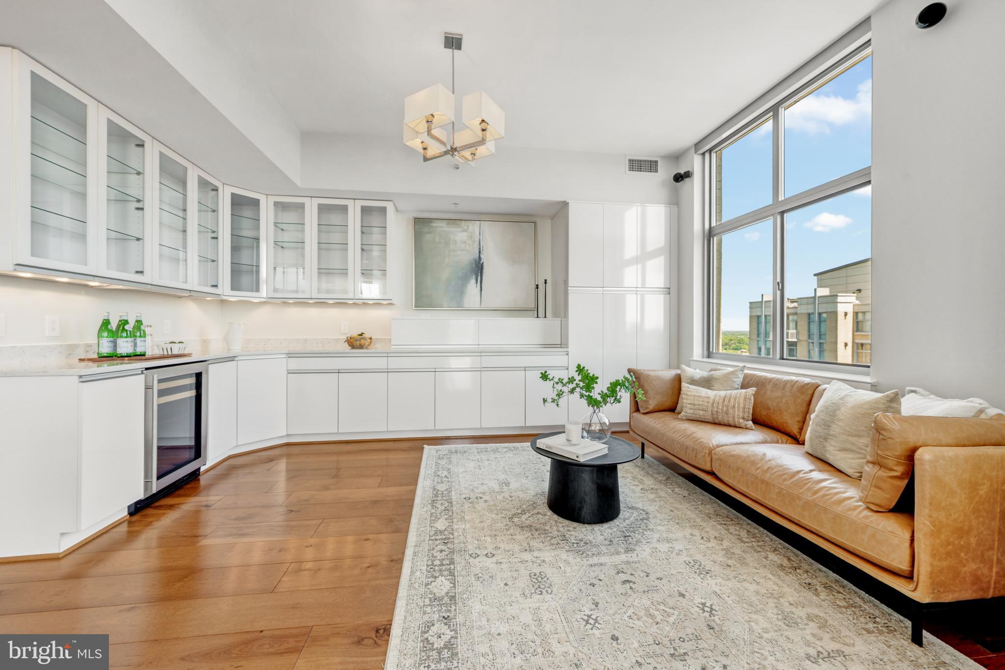 11990 Market Street, Unit 2112 Reston, VA 20190 - Photo 21 of 92 a living room with furniture and kitchen view
