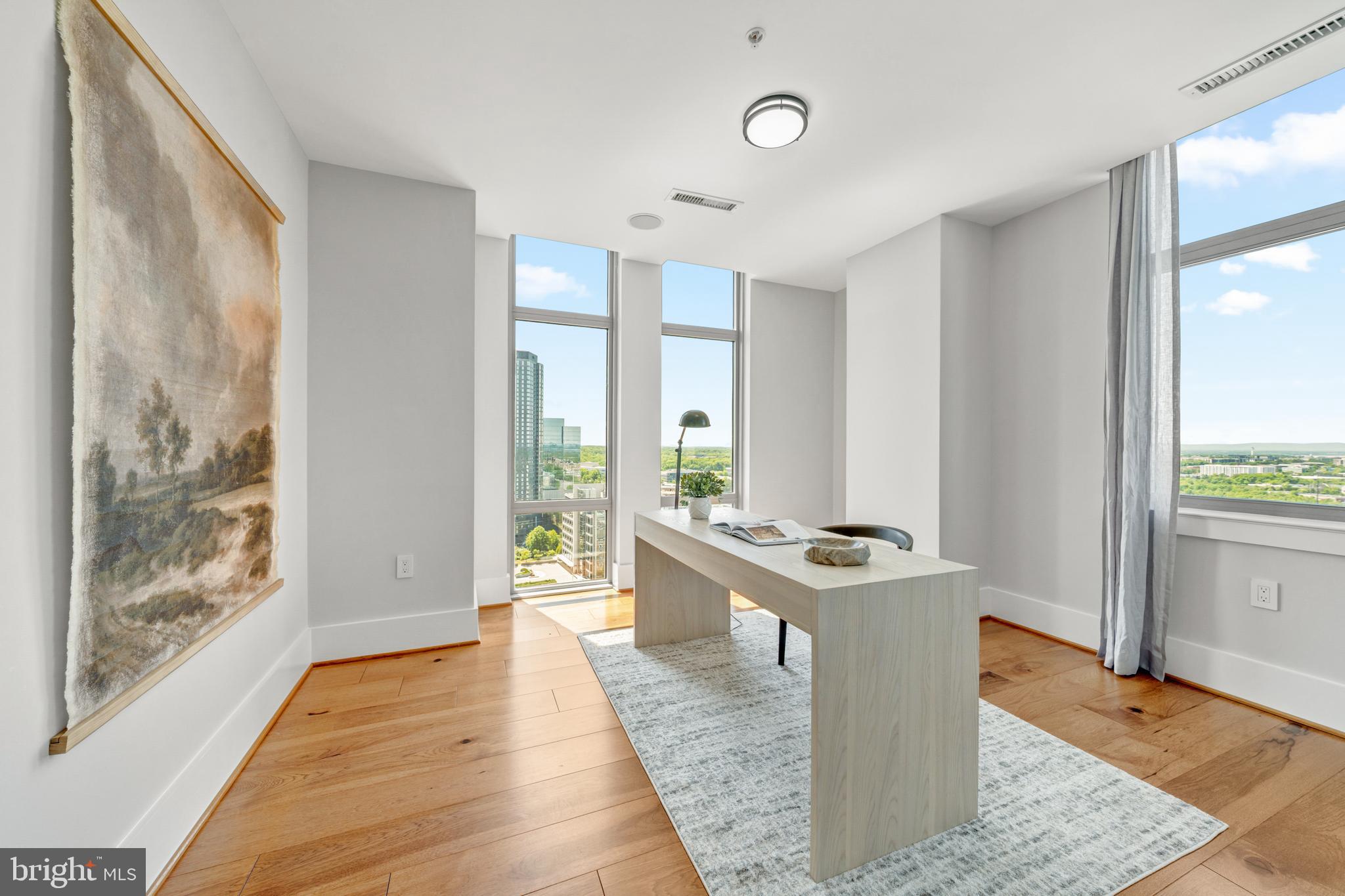 11990 Market Street, Unit 2112 Reston, VA 20190 - Photo 22 of 92 a view of a kitchen with a sink and wooden floor