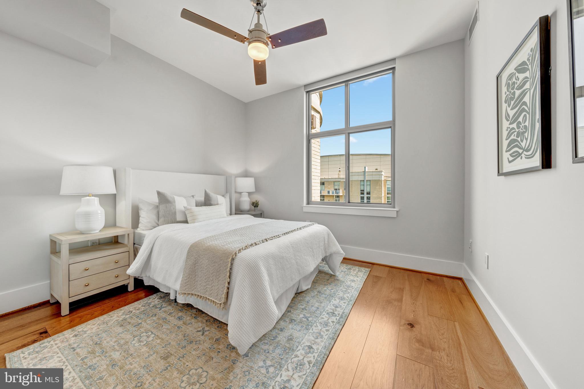 11990 Market Street, Unit 2112 Reston, VA 20190 - Photo 30 of 92 a bedroom with a bed and a window