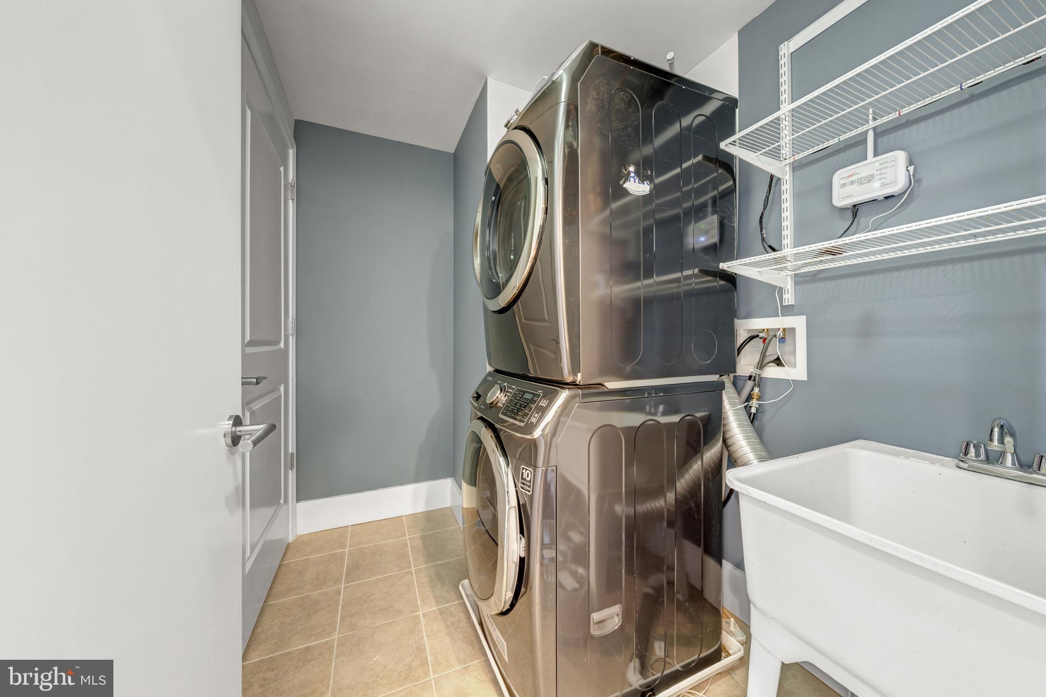 11990 Market Street, Unit 2112 Reston, VA 20190 - Photo 32 of 92 a utility room with dryer and washer