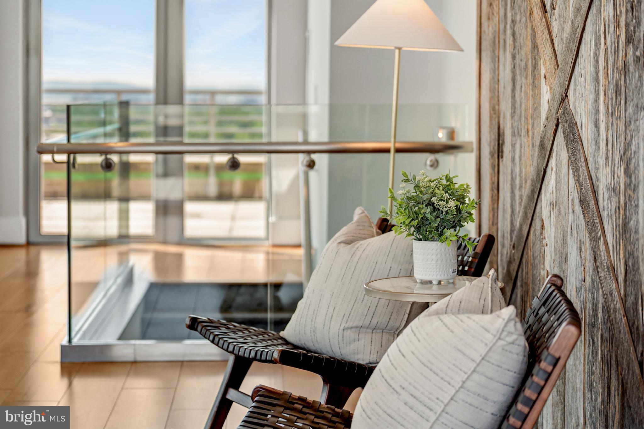 11990 Market Street, Unit 2112 Reston, VA 20190 - Photo 38 of 92 a view of a balcony with chairs