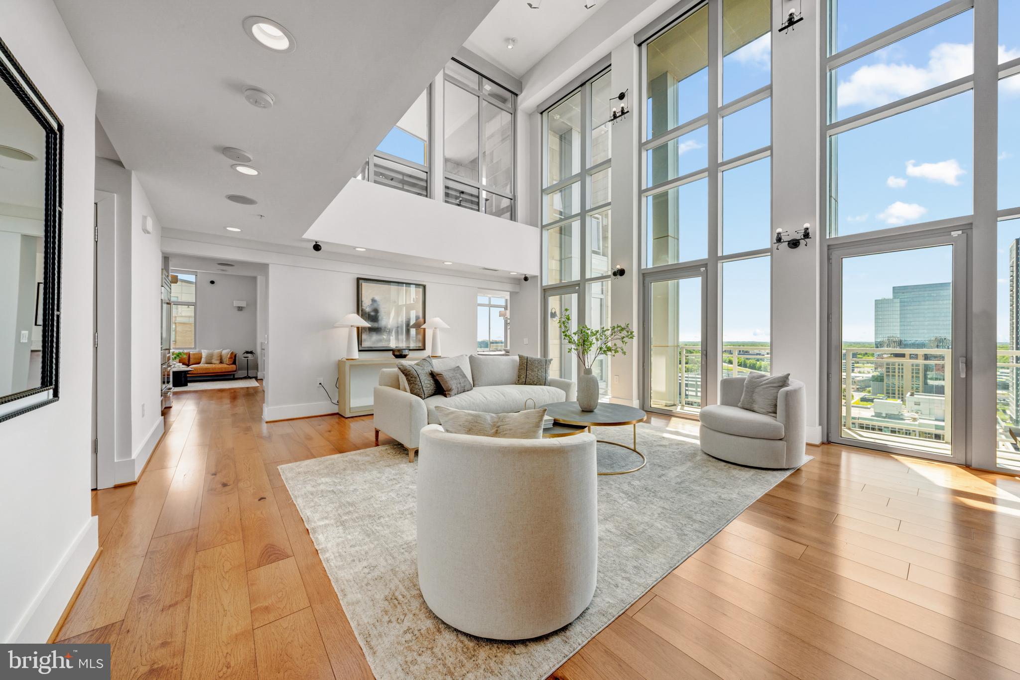 11990 Market Street, Unit 2112 Reston, VA 20190 - Photo 4 of 92 a living room with fireplace furniture and a large window