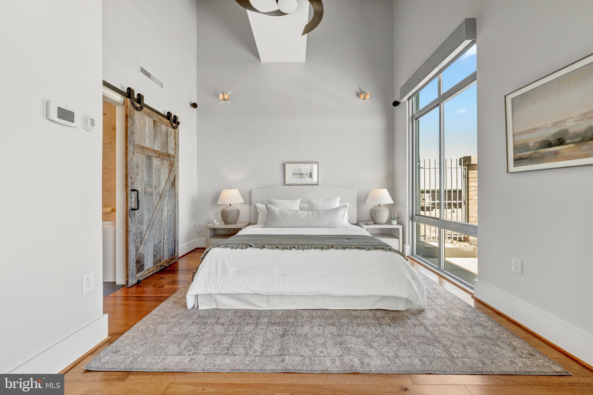 11990 Market Street, Unit 2112 Reston, VA 20190 - Photo 41 of 92 a large white bed in a white room