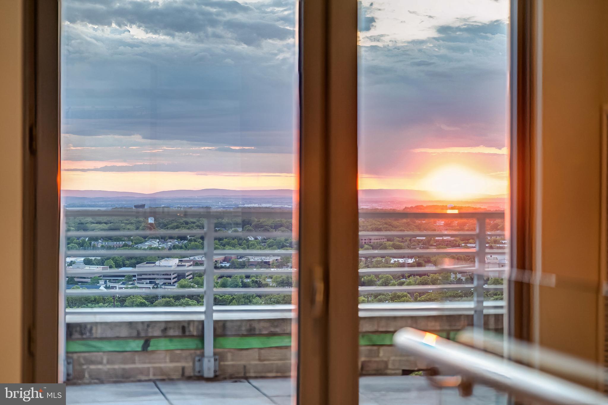 11990 Market Street, Unit 2112 Reston, VA 20190 - Photo 48 of 92 a view of a glass door of the house from a window