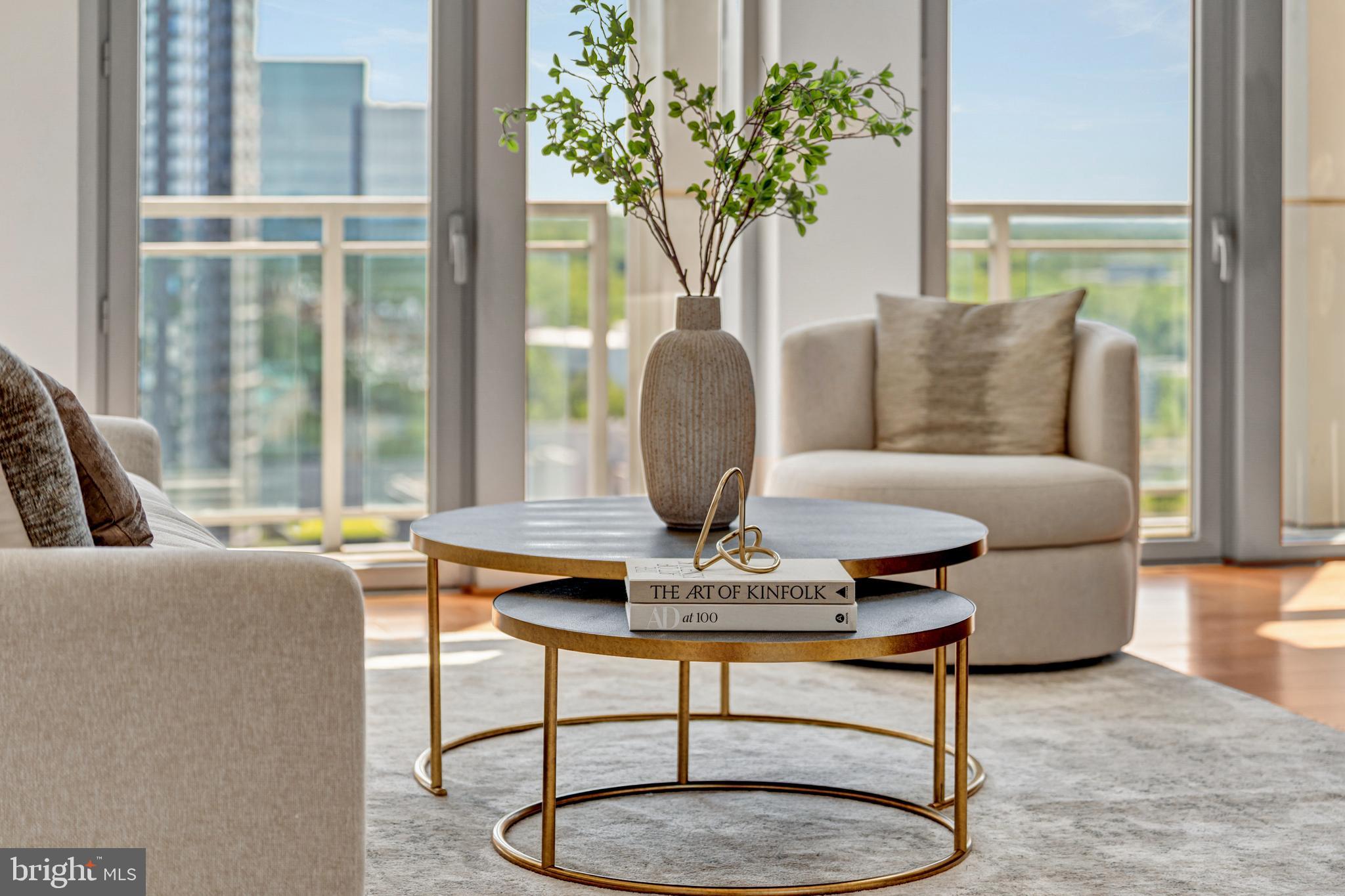 11990 Market Street, Unit 2112 Reston, VA 20190 - Photo 5 of 92 a living room with furniture a table and a potted plant