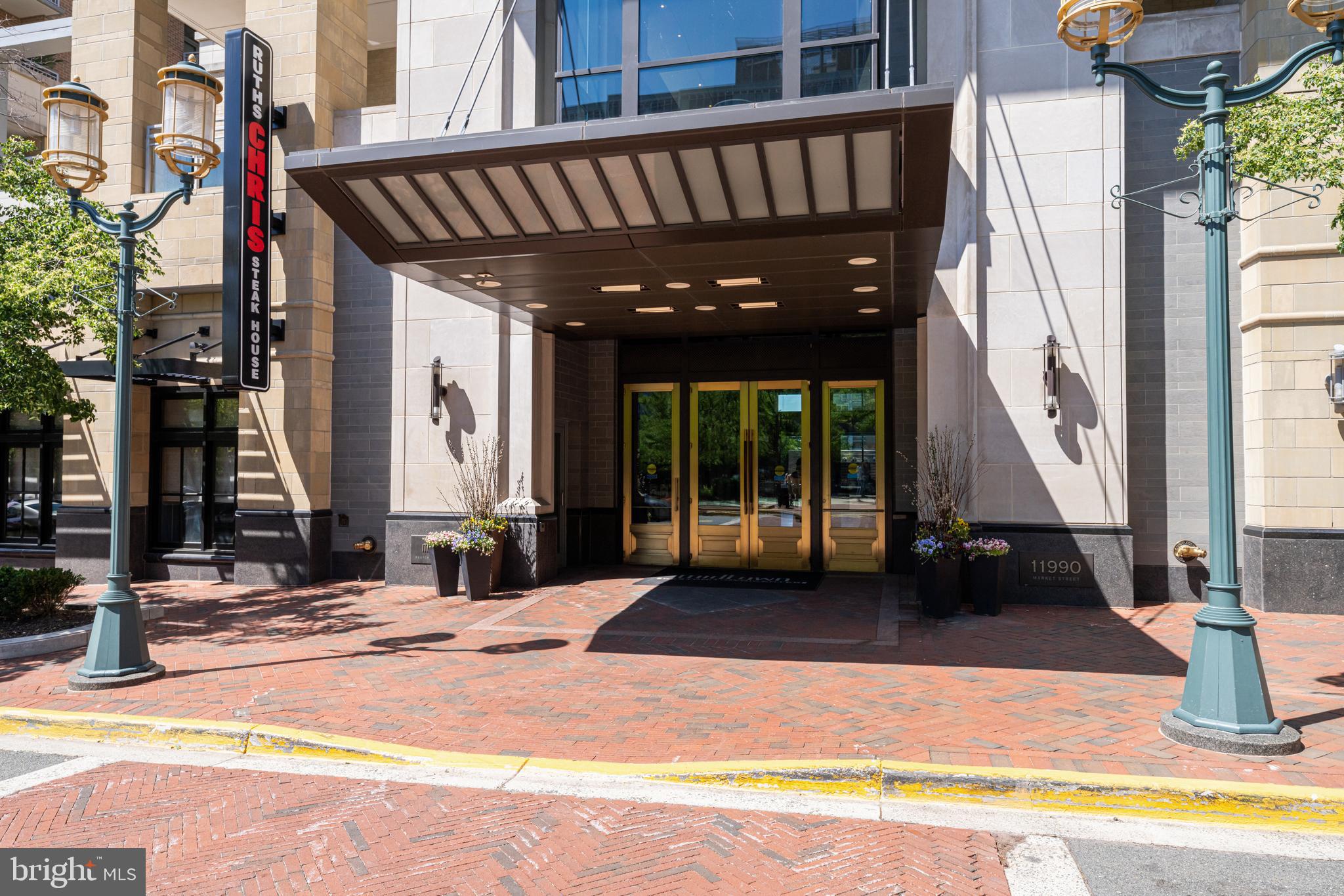 11990 Market Street, Unit 2112 Reston, VA 20190 - Photo 69 of 92 a view of swimming pool with an outdoor seating