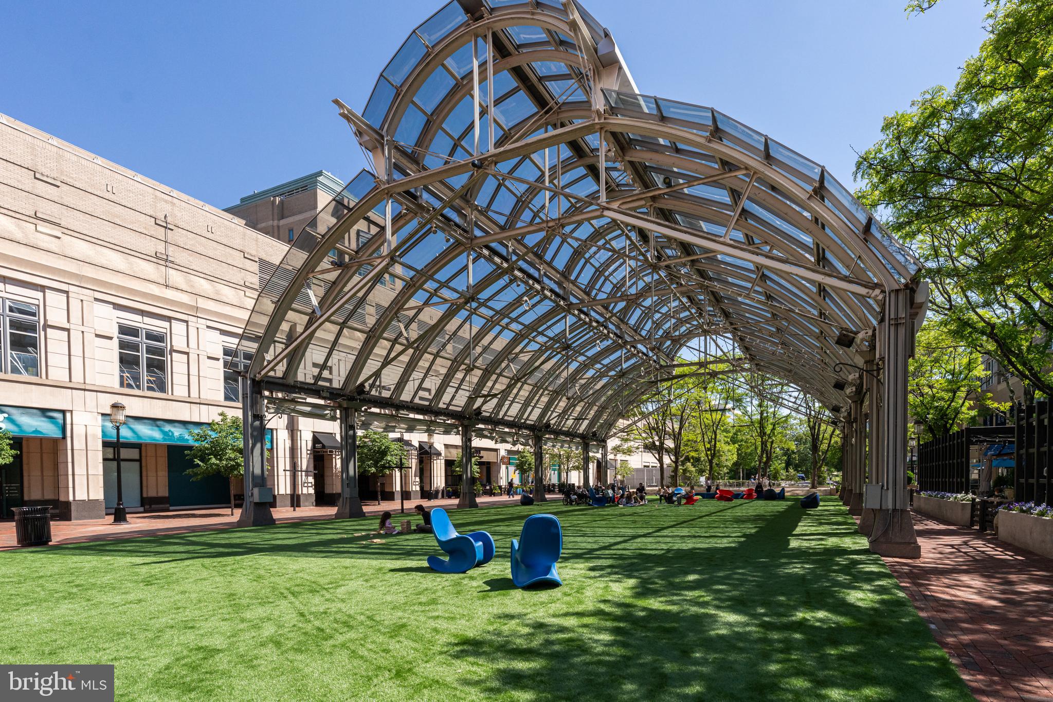 11990 Market Street, Unit 2112 Reston, VA 20190 - Photo 78 of 92 a view of a big building with a big yard and large trees