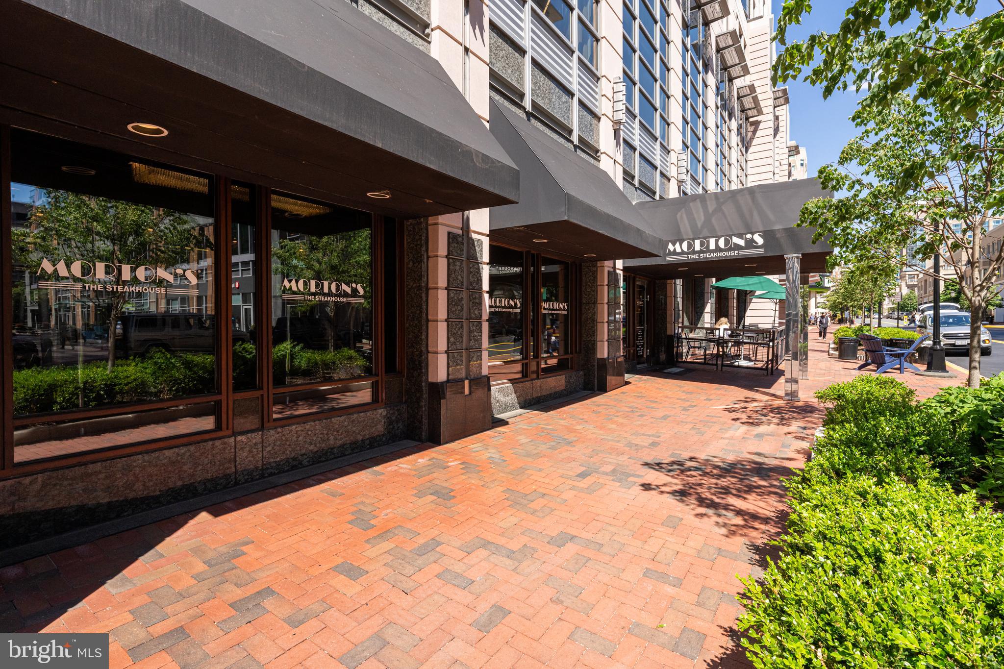 11990 Market Street, Unit 2112 Reston, VA 20190 - Photo 89 of 92 a swimming pool with outdoor seating and yard