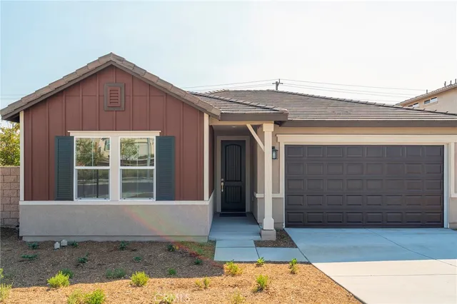 a front view of a house with large windows