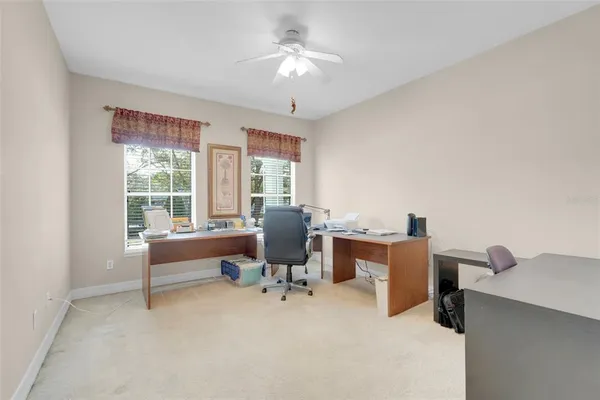 a view of a livingroom with furniture and a window