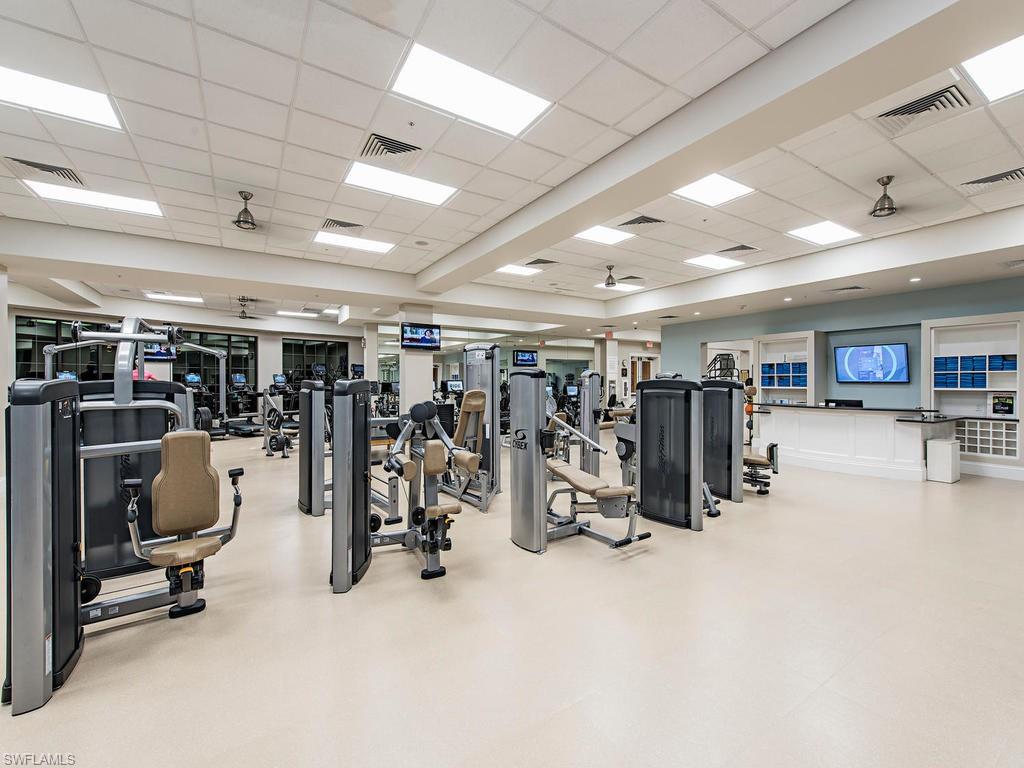 14903 Bellezza Lane Naples, FL 34110 - Photo 23 of 25 a view of a room with gym equipment