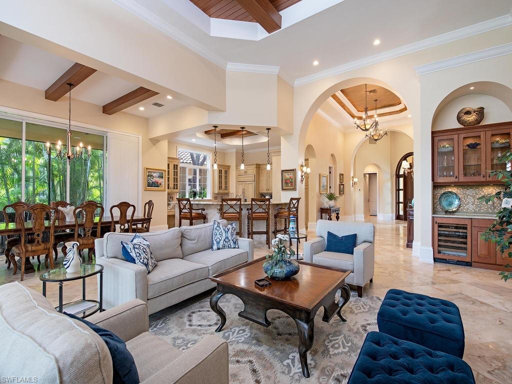 14903 Bellezza Lane Naples, FL 34110 - Photo 6 of 25 a living room with furniture a rug and a large window