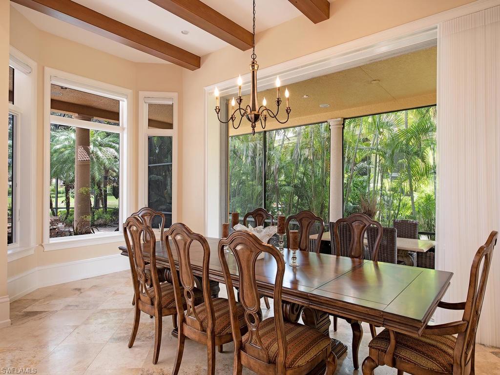 14903 Bellezza Lane Naples, FL 34110 - Photo 9 of 25 a view of a dining room with furniture window and outside view