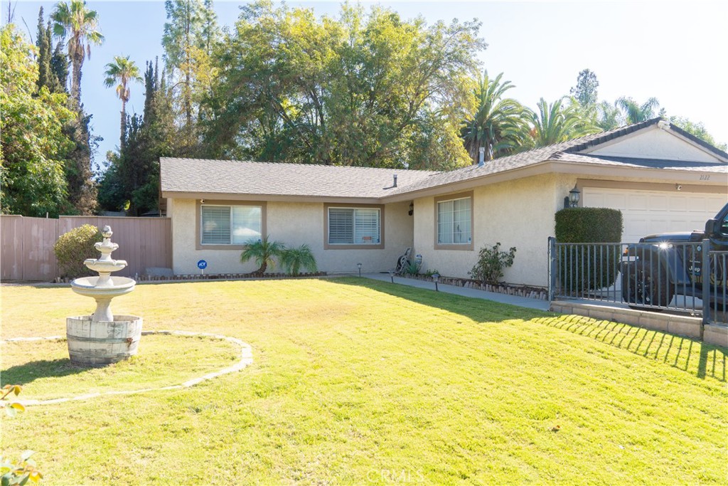 2122 Trafalgar Avenue Riverside, CA 92506 - Photo 2 of 18 a view of a swimming pool with plants and trees