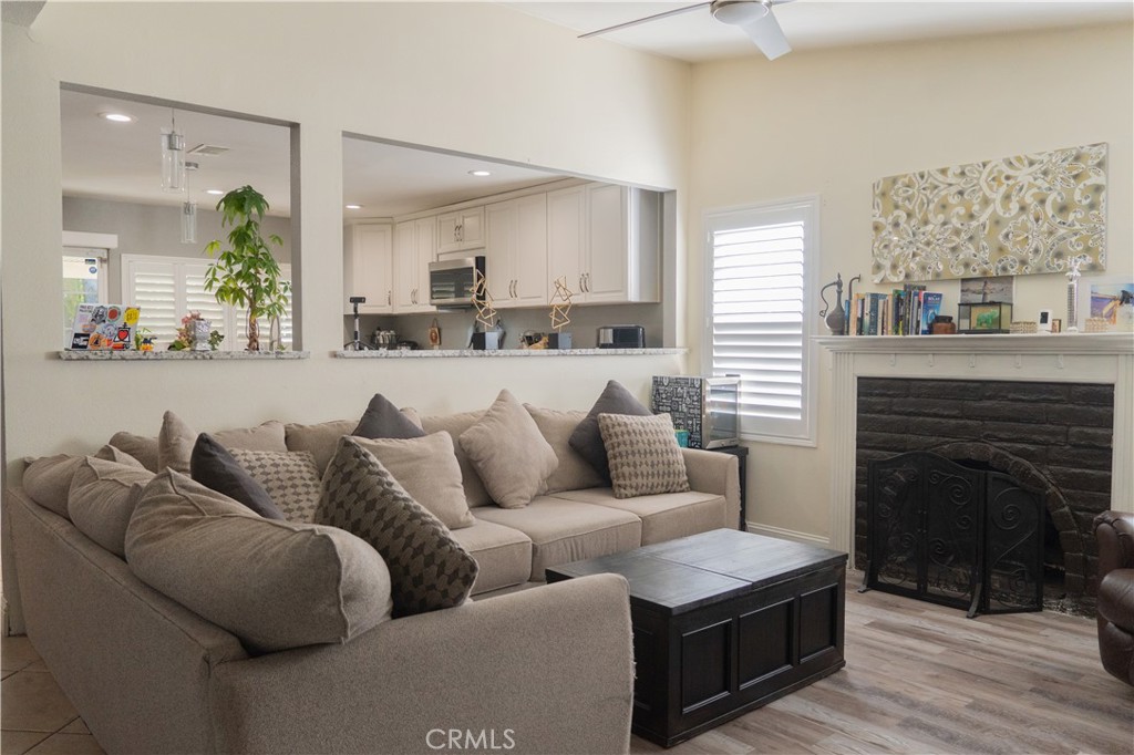 2122 Trafalgar Avenue Riverside, CA 92506 - Photo 3 of 18 a living room with furniture and a fireplace