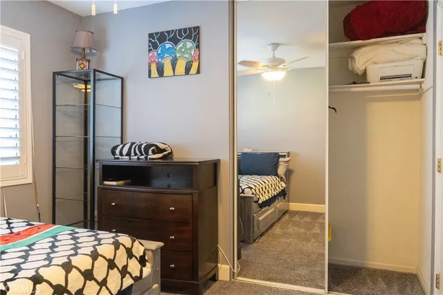 a bedroom with a bed and a cabinets