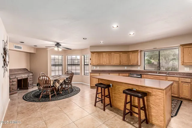 a kitchen with stainless steel appliances a refrigerator sink and microwave