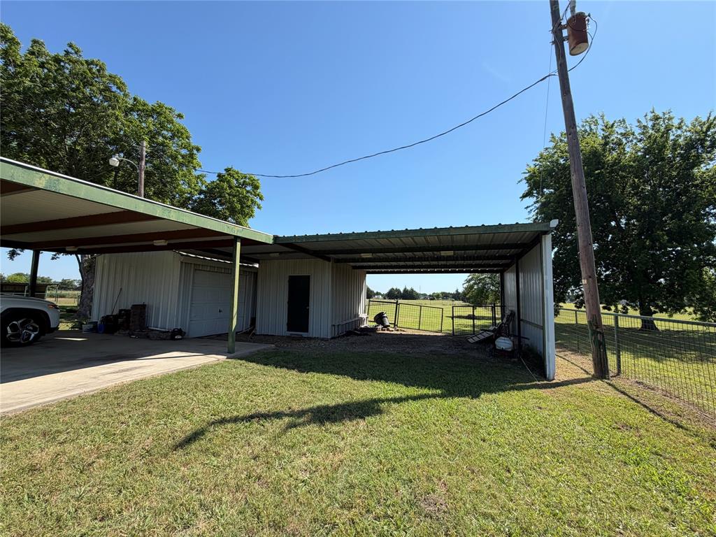 330 South Goode Road Wilmer, TX 75172 - Photo 31 of 38 a view of a house with a yard and garage
