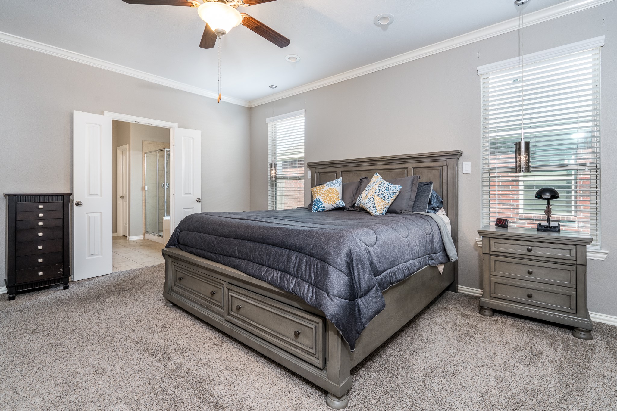 17823 Dappled Walk Way Cypress, TX 77429 - Photo 11 of 23 a bedroom with a bed and a ceiling fan