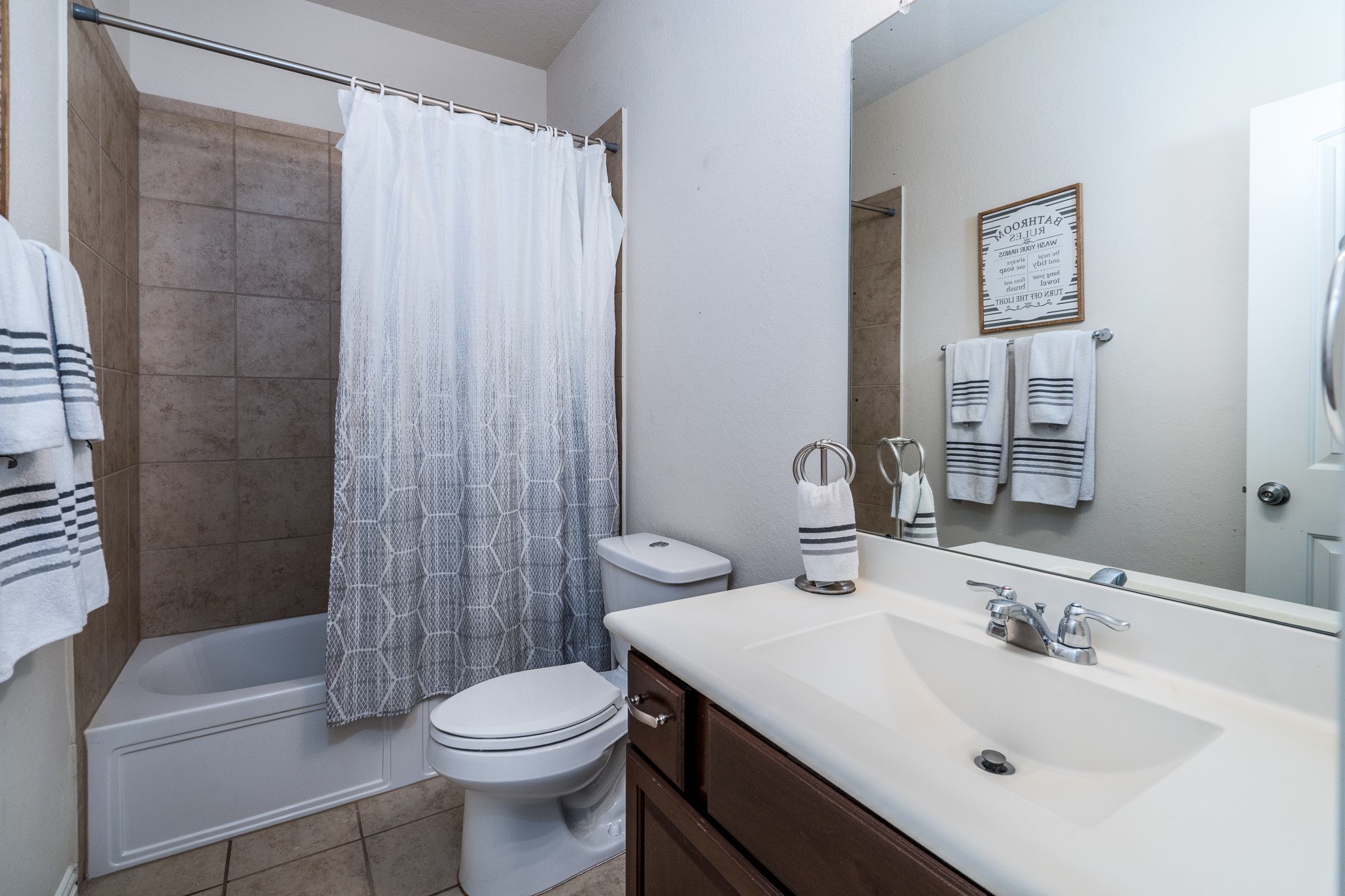 17823 Dappled Walk Way Cypress, TX 77429 - Photo 16 of 23 a bathroom with a sink toilet and shower