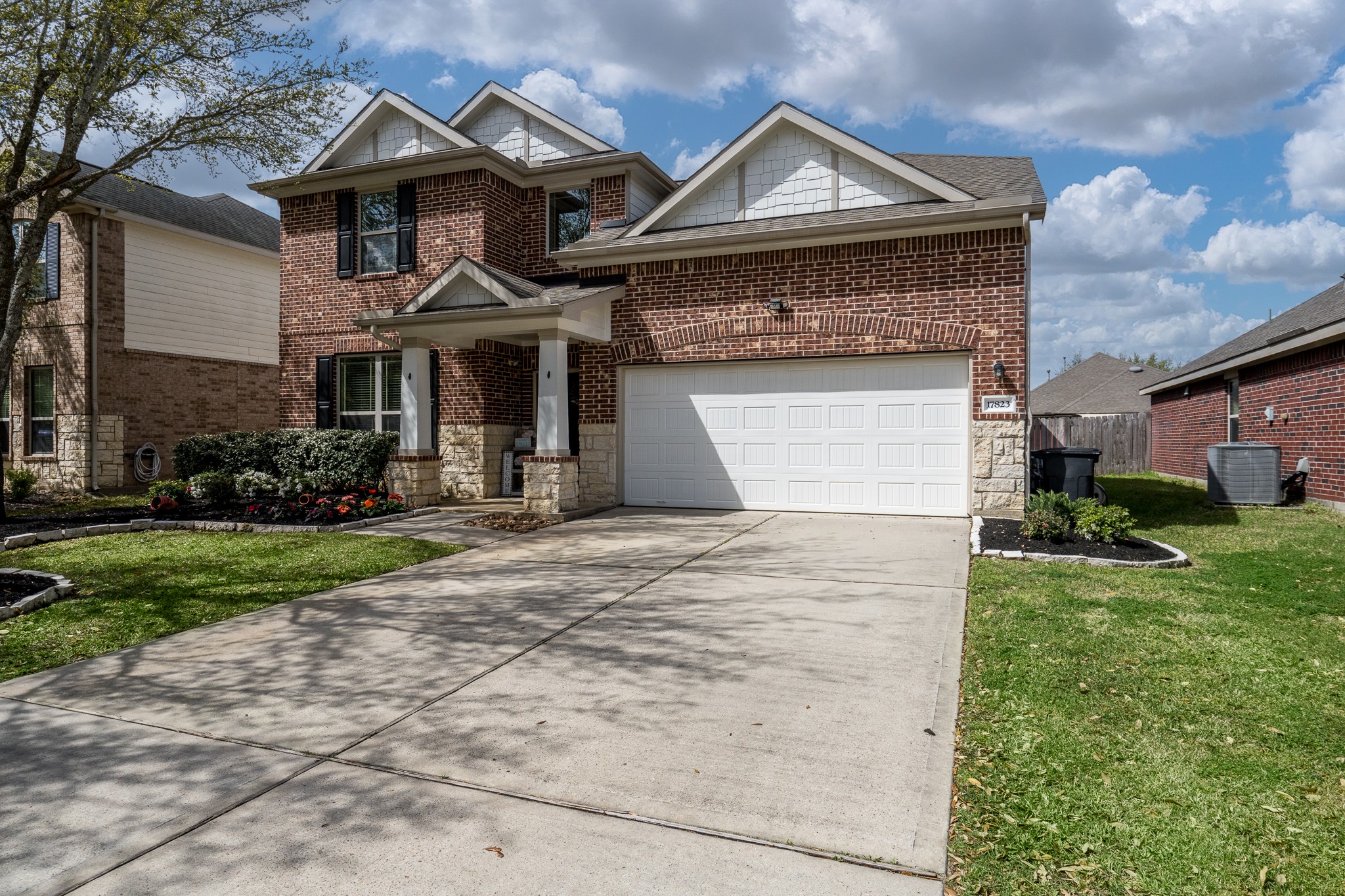 17823 Dappled Walk Way Cypress, TX 77429 - Photo 2 of 23 a front view of a house with a yard and garage