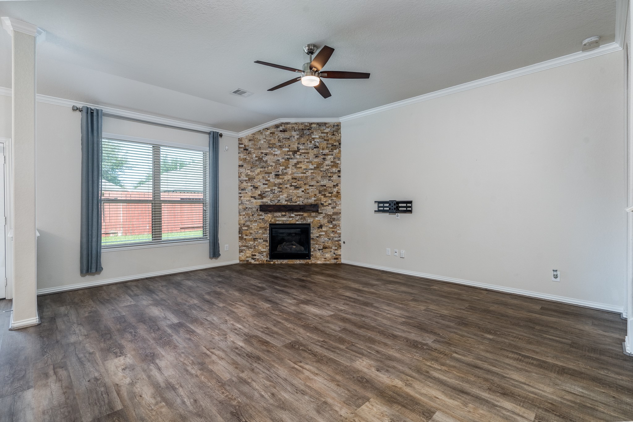 17823 Dappled Walk Way Cypress, TX 77429 - Photo 4 of 23 wooden floor in an empty room with a window