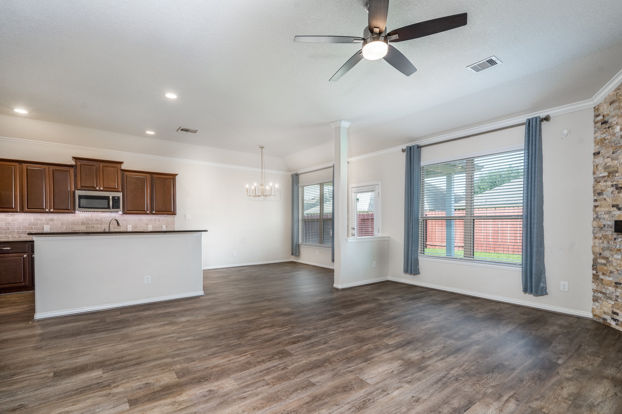 17823 Dappled Walk Way Cypress, TX 77429 - Photo 6 of 23 a view of an empty room with a kitchen