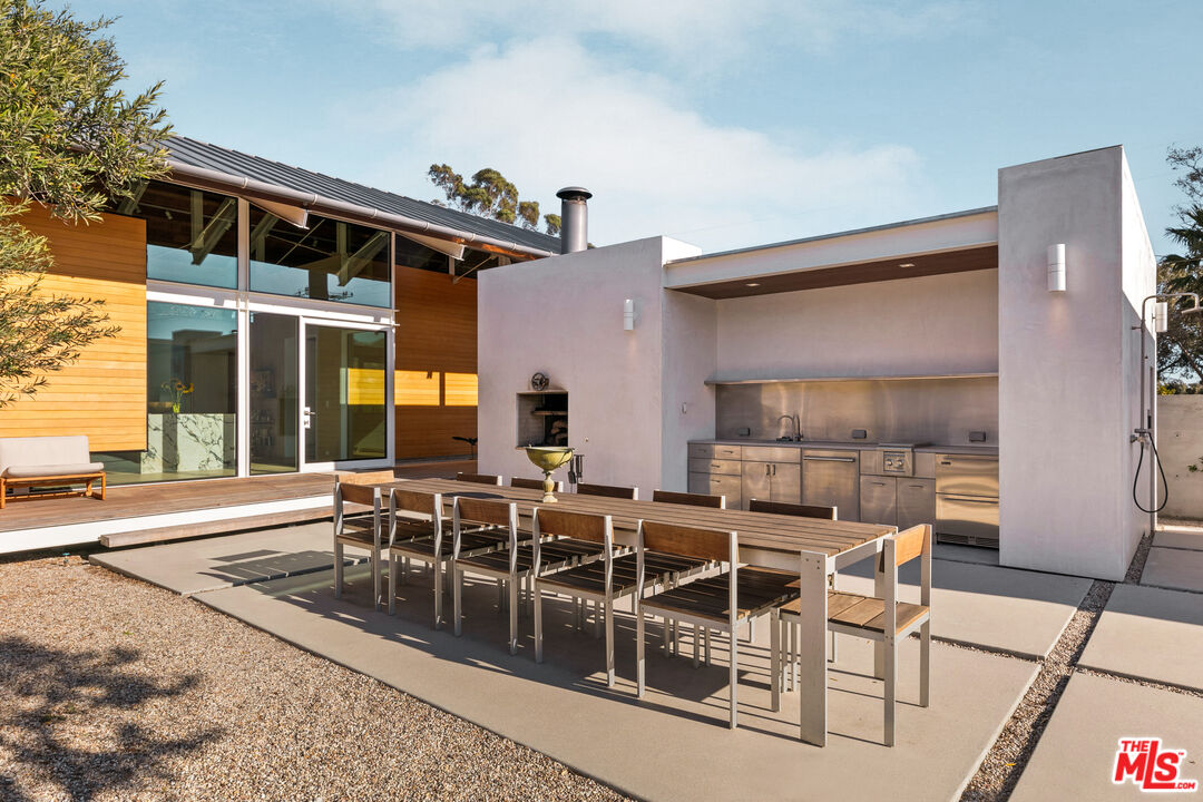 6728 Wildlife Road Malibu, CA 90265 - Photo 43 of 57 a dinning area with furniture and outdoor view