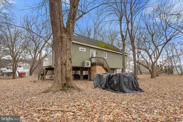 a backyard of a house with large trees