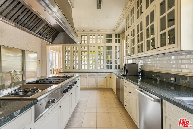 a spacious bathroom with a double vanity sink a mirror and a bathtub