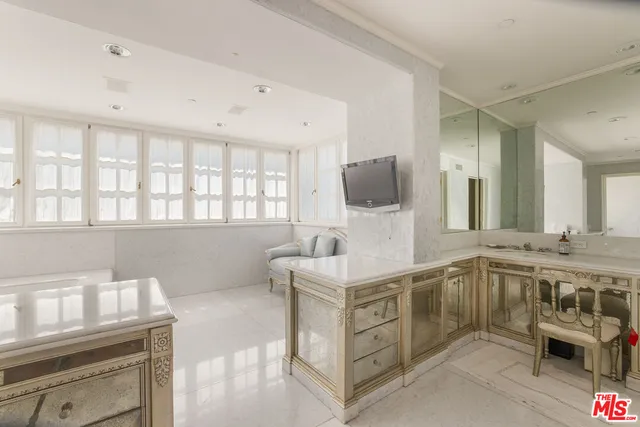 a view of swimming pool with outdoor seating and yard in back