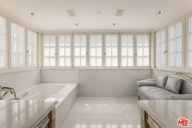 a view of a chairs and table in backyard