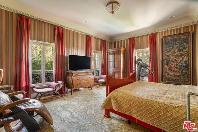 a room with gym equipment and glass door