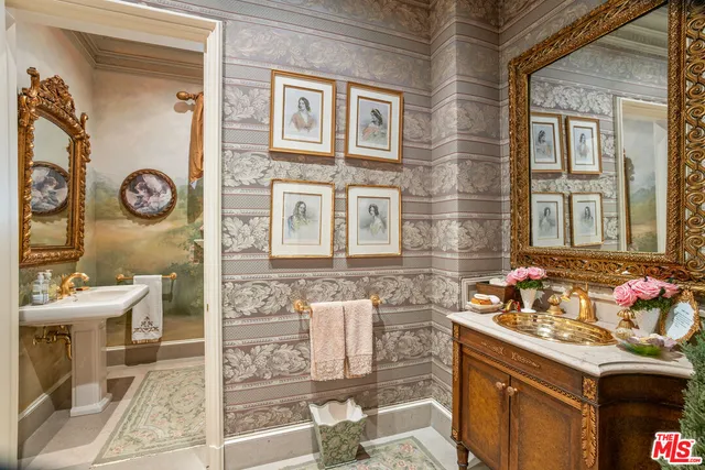 a dining room with furniture a chandelier and wooden floor