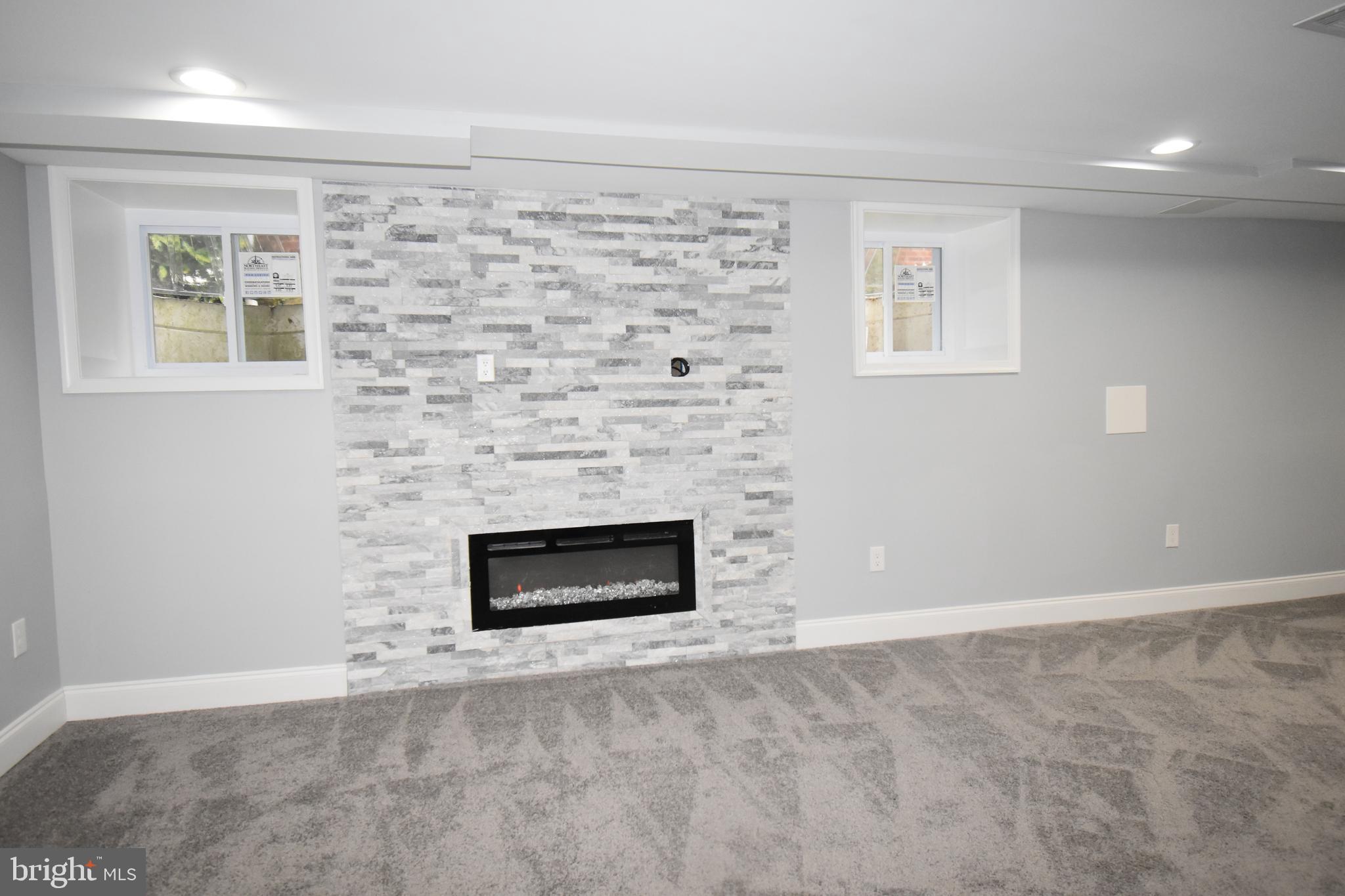 1508 Kingsway Road Baltimore, MD 21218 - Photo 22 of 28 Basement Recreation Room with Fireplace