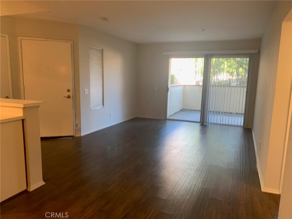 158 South Cross Creek Road, Unit D Orange, CA 92869 - Photo 3 of 7 an empty room with wooden floor and windows