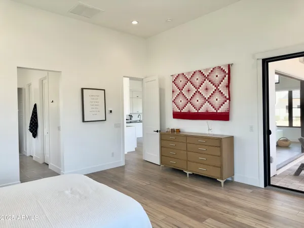 a spacious bathroom with a double vanity sink and a mirror